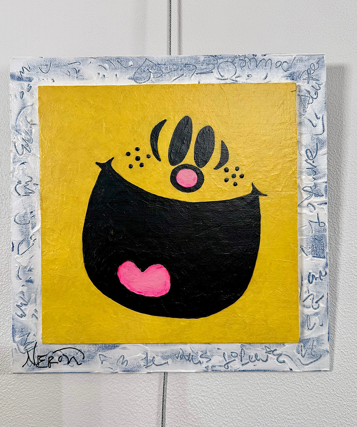 Little Miss Sunshine I (2025) by Audrey Néron, full front view of a signed 10 × 10 in original pop artwork with a smiling face, bright yellow background and textured paper border.