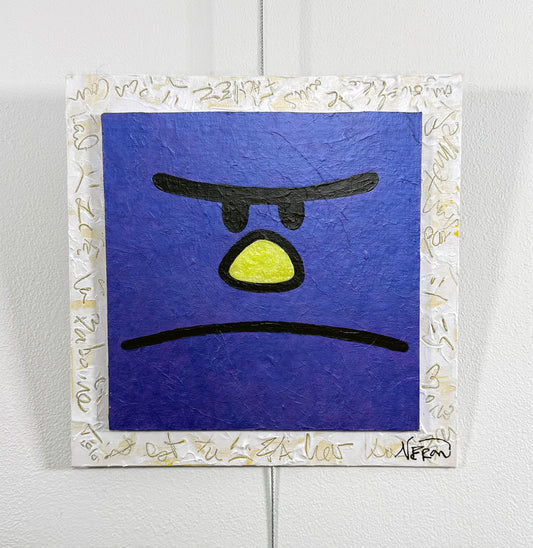 Pop-art square painting of a purple character with a frowning expression, yellow nose, and bold black features, framed by a white border with gold scribbles. Mixed-media artwork by Audrey Néron.